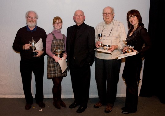 Left to right:- Derek Blackwood, set builder for Leitheatre (Stage Right) with the Bobby Watt Cup for Best Stage Presentation; Rosalind Becroft, director for Leitheatre (Stage Right) with the Ian Wishart Quaich for third place; Alasdair Hawthorn the adjudicator; Ron Cattell, director of St Serf's Players with the Eric Bennett Trophy for Highest Marks for Production and the Edith Forbes Trophy for first place; Lynne Hurst, director of Livingston Players with the Mrs Charles Rowland Cup for the Second placed team and the John McIntyre Trophy for Best Moment of Theatre. Photo: Jon Davey