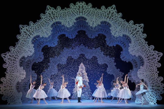 Amy Pollock as Clara, with Remi Andreoni as the Nutcracker Prince, Luciana Ravizzi as the Snow Queen and Company members in Peter Darrell’s The Nutcracker. Photo by Andy Ross