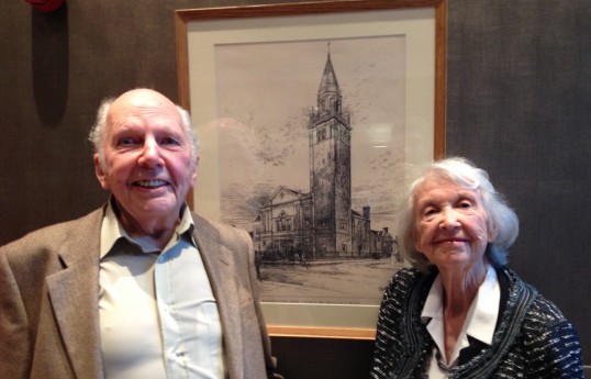 Deryk Gould and Christelle Steele with a copy of architect Hippolyte Blanc's drawing for the original church. The tower was never built. Photo Thom Dibdin