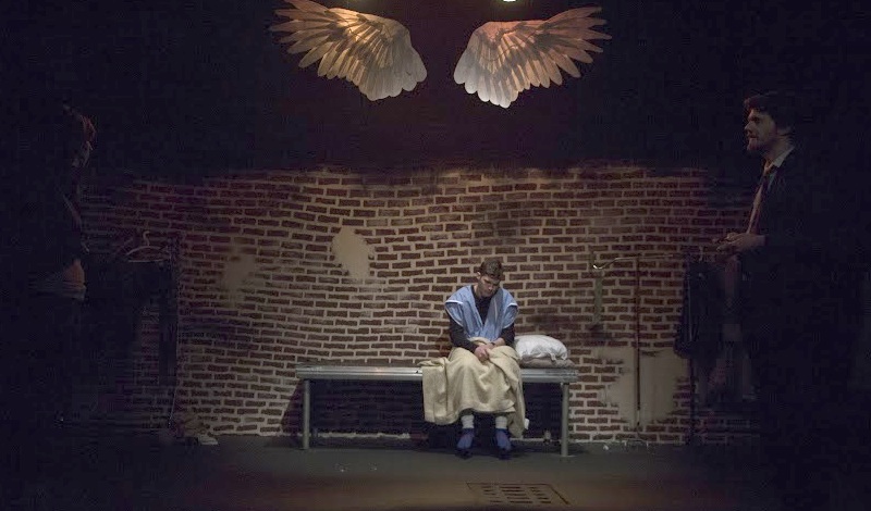 A scene from Angels In America with (left to right) Meera Muñoz Pandya as Belize, Brooks Hudgins as Prior Walter, and Rob Younger as Louis Ironson