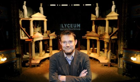 David Greig with set of The Iliad. Photo Colin Hattersley Royal Lyceum Theatre Edinburgh new artistic director David Greig announces first theatrical season, Edinburgh, Tuesday 03/05/2016: New artistic director of the Royal Lyceum Theatre Edinburgh, pictured with the set of "Iliad" - the Lyceum's current production (but not one by David Greig). Free FIRST USE (ONLY) picture. More info from: Clare McCormack, Senior Publicist at The Corner Shop PR: email: press@lyceum.org.uk /07989 950871 or Harriet Mould, The Lyceum Press and PR Officer: email: hmould@lyceum.org.uk / 0131 202 6220 / 07454 816 116 Photography from: Colin Hattersley Photography - colinhattersley@btinternet.com - www.colinhattersley.com - 07974 957 388