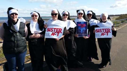 It's a blessing - The cast of Sister Act set out from Seton Sands for their walk to the Brunton. Photo: Encore