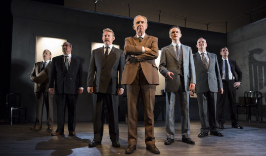"A parade of middle-aged men standing on stage talking". The Democracy cast. Photo: Richard Campbell