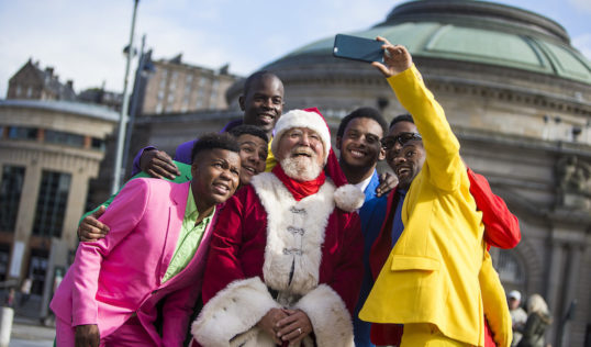 The Moes and Nomax get a selfie with Father Christmas. Photo: Duncan McGlynn