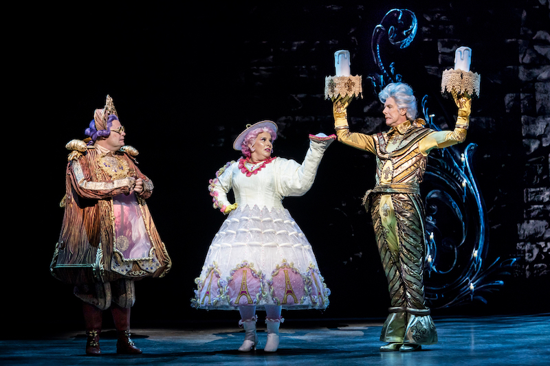 Nigel Richards as Cogsworth, Sam Bailey as Mrs Potts, Gavin Lee as Lumiere in Disney’s Beauty and the Beast – Photo by Johan Persson